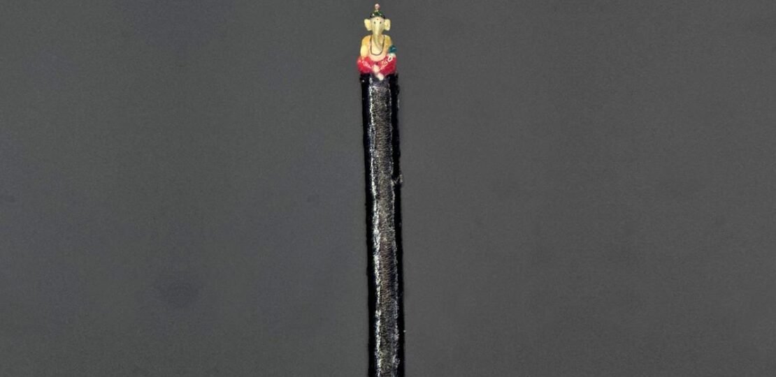 Miniature Ganesha Sculpted on a Human Hair Strand